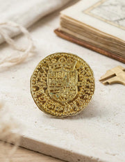 Moneda 2 Escudos dorada, 3 cms.