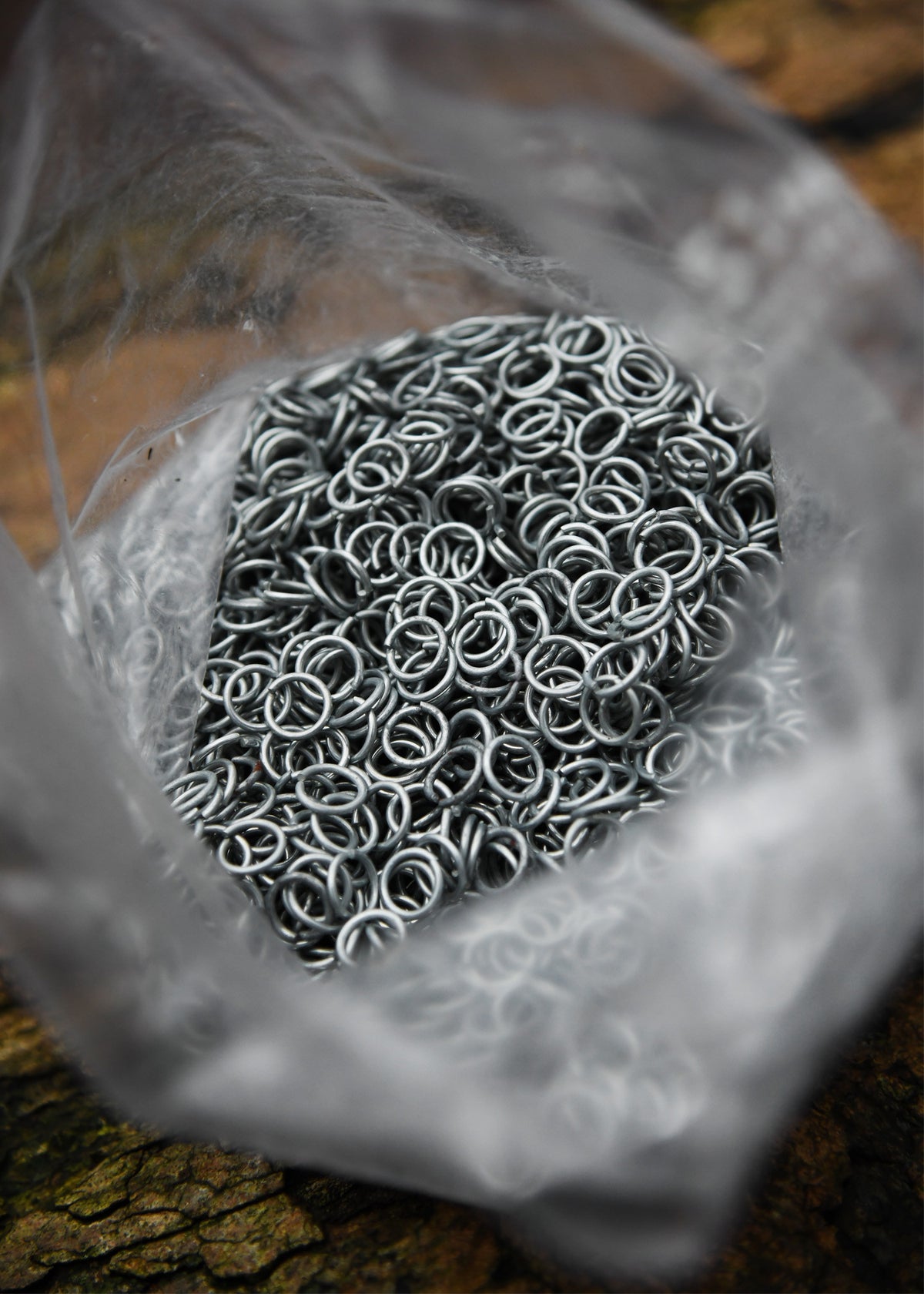 Bolsa anillas zinc cota malla, 9 mm.